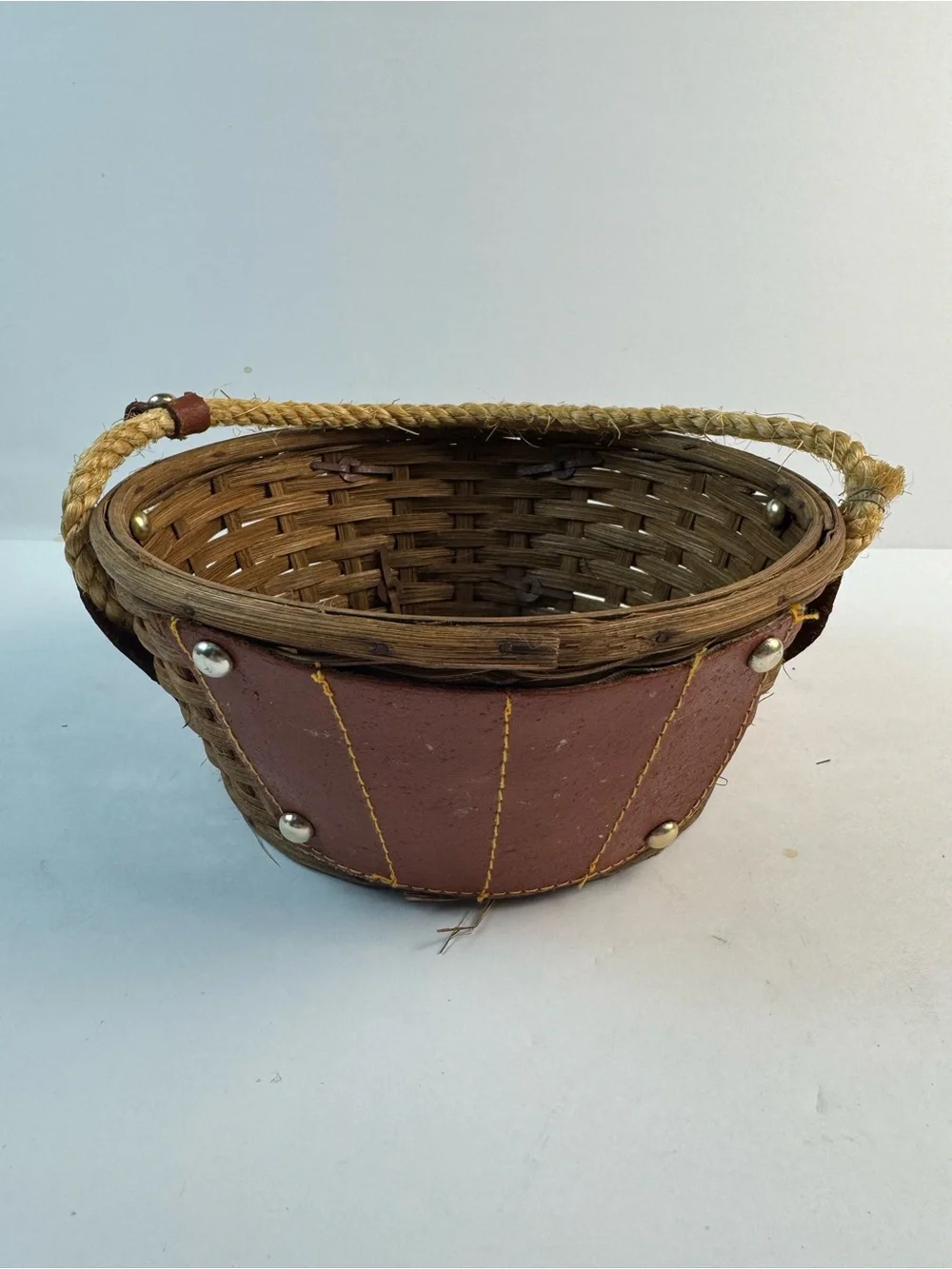 Vintage mid-centuryWoven Straw basket with Brown Leather Panels and Rope Handle